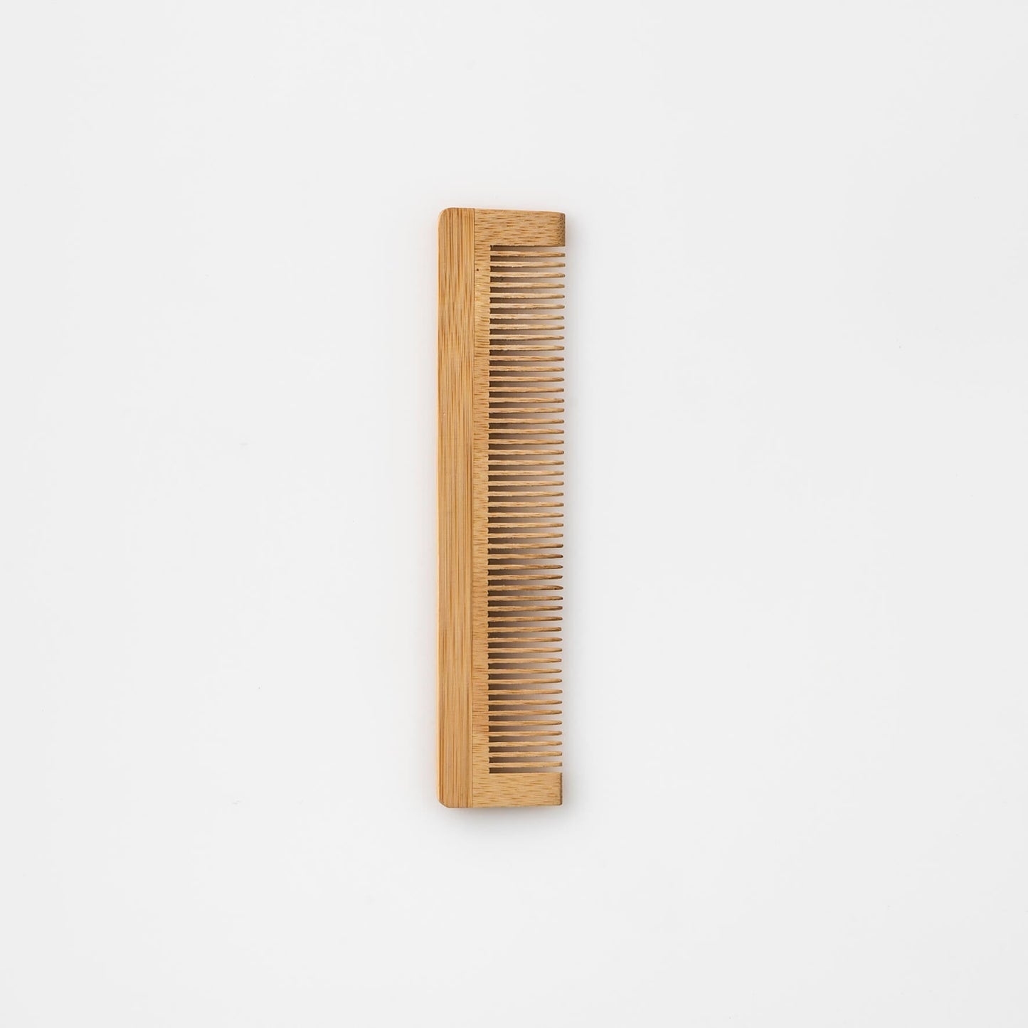 A Bristolmade bamboo comb with smooth, evenly spaced teeth, crafted from sustainable bamboo and designed for gentle hair care.