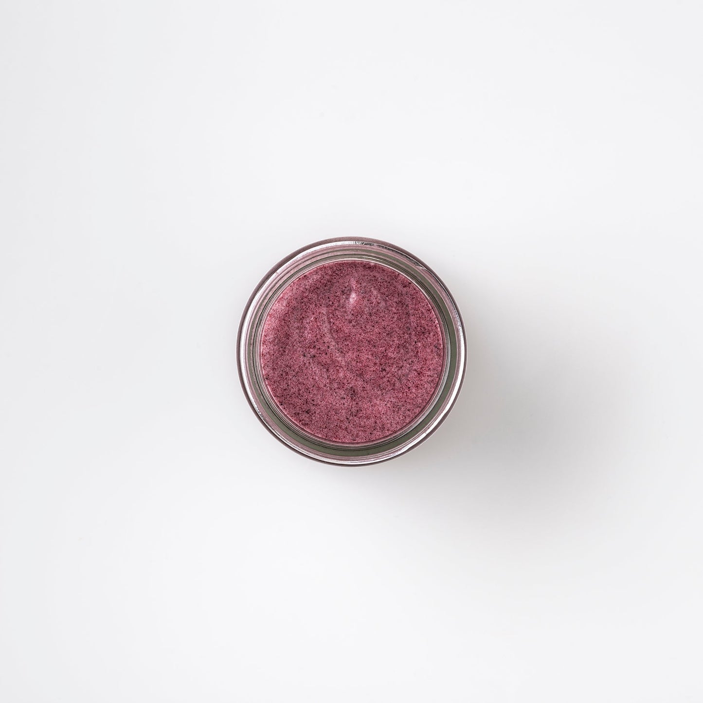 the top view of Bristolmade Exfoliating Face Scrub Beetroot & Shea Butter , showing the deep pink, natural ingredients and the exfoliating particles.