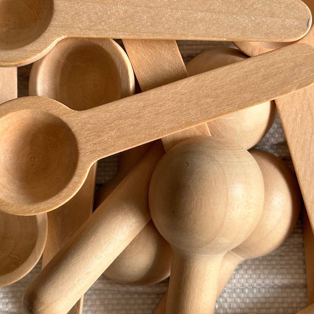photo of small bamboo spoons that can be used with the powder to foam cleanser.
